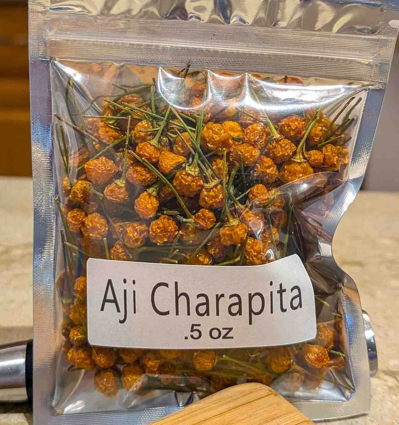 a half ounce bag of dried aji charapita peppers, the most expensive chili peppers in the world